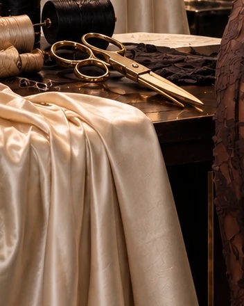 Silk fabric and gold scissors